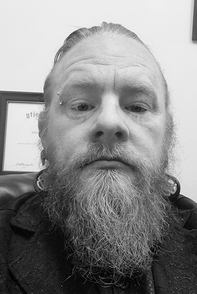 black and white portrait image of Frank Leach